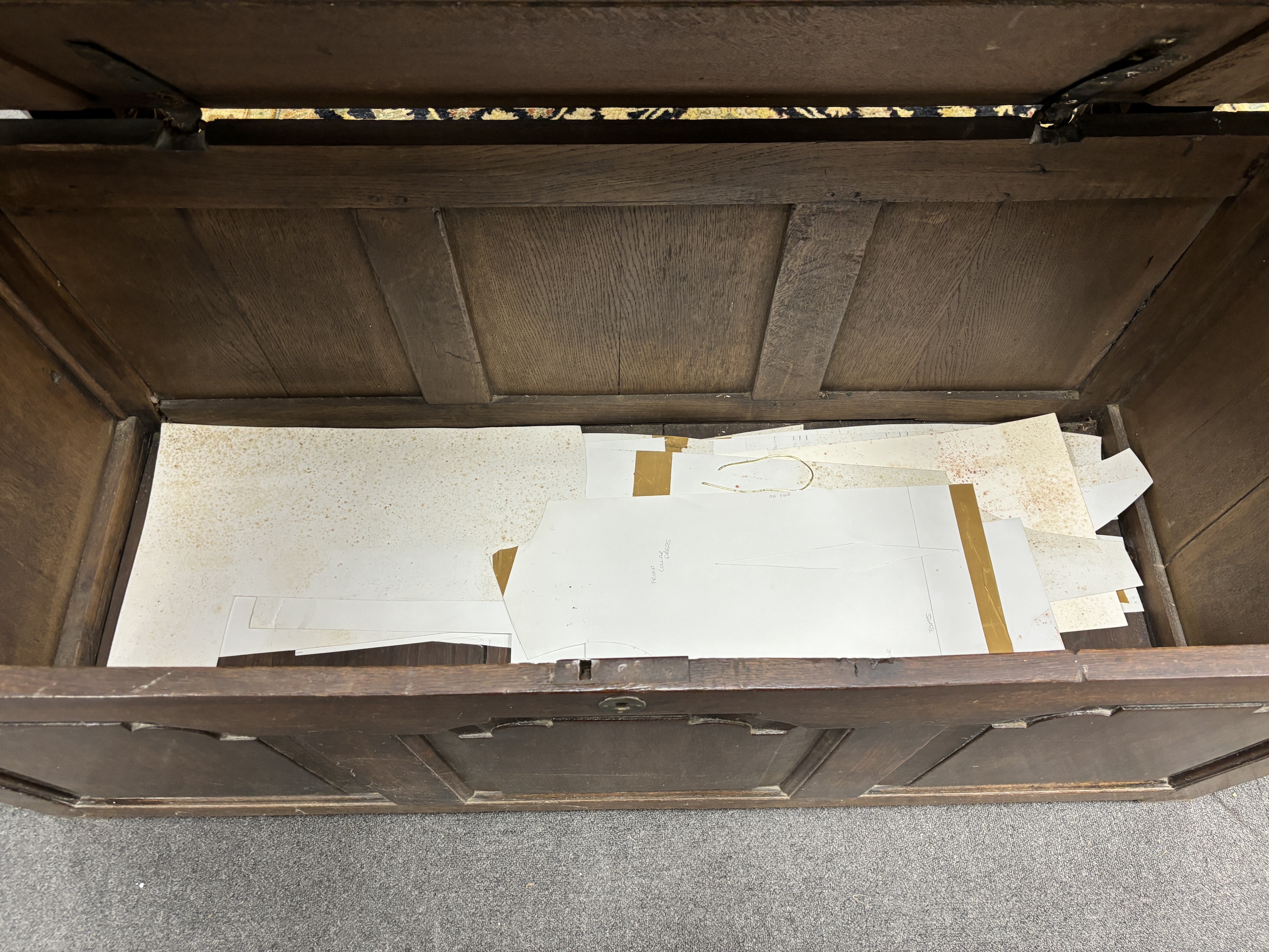 A mid 18th century oak coffer, with a triple arched fielded panelled front, width 146cm, depth 66cm, height 60cm